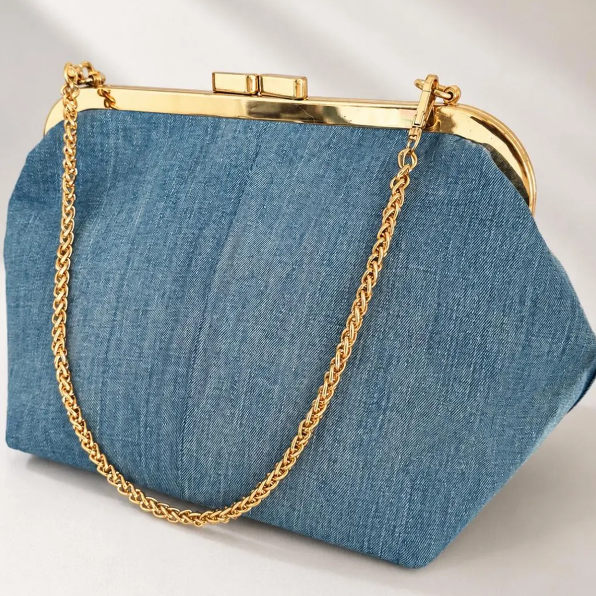 Light Wash Blue Woven Denim Rectangular Frame Clutch With Polished Gold Rim Press Clasp, Detachable Linked Metal Chain And Velvet Lined Inner Zip Divider Slot
