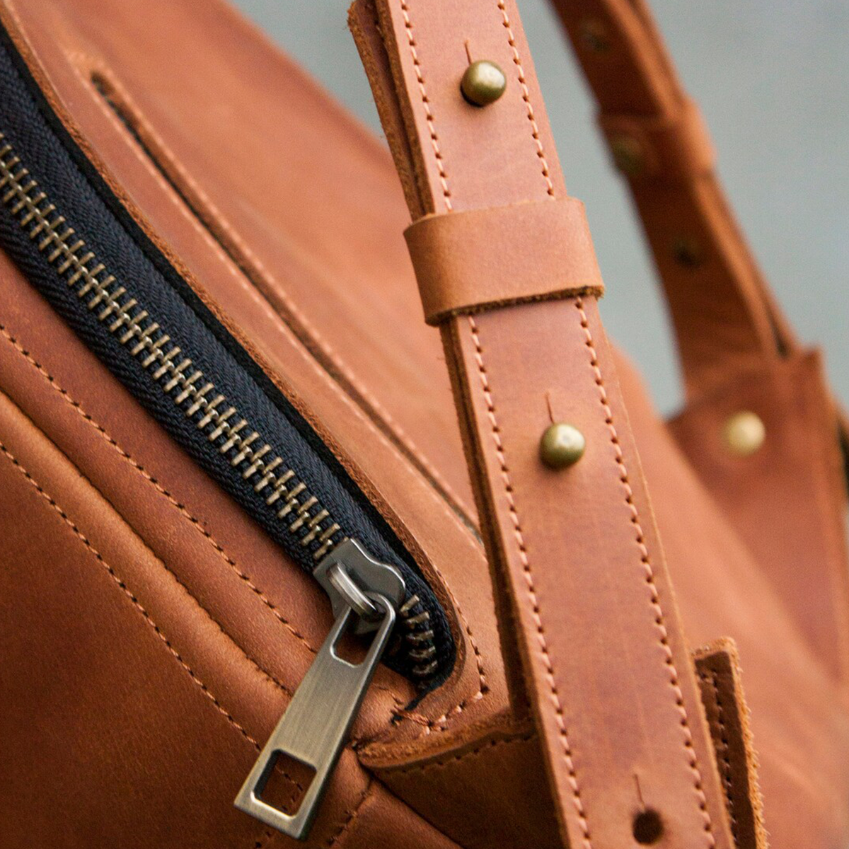Warm Vintage Tan Compact Geometric Trapezoid Rucksack With Full Antique Metal Zip Closure, Divided Lined Inner Cavity And Stud Fastened Rear Carry Straps Backpack
