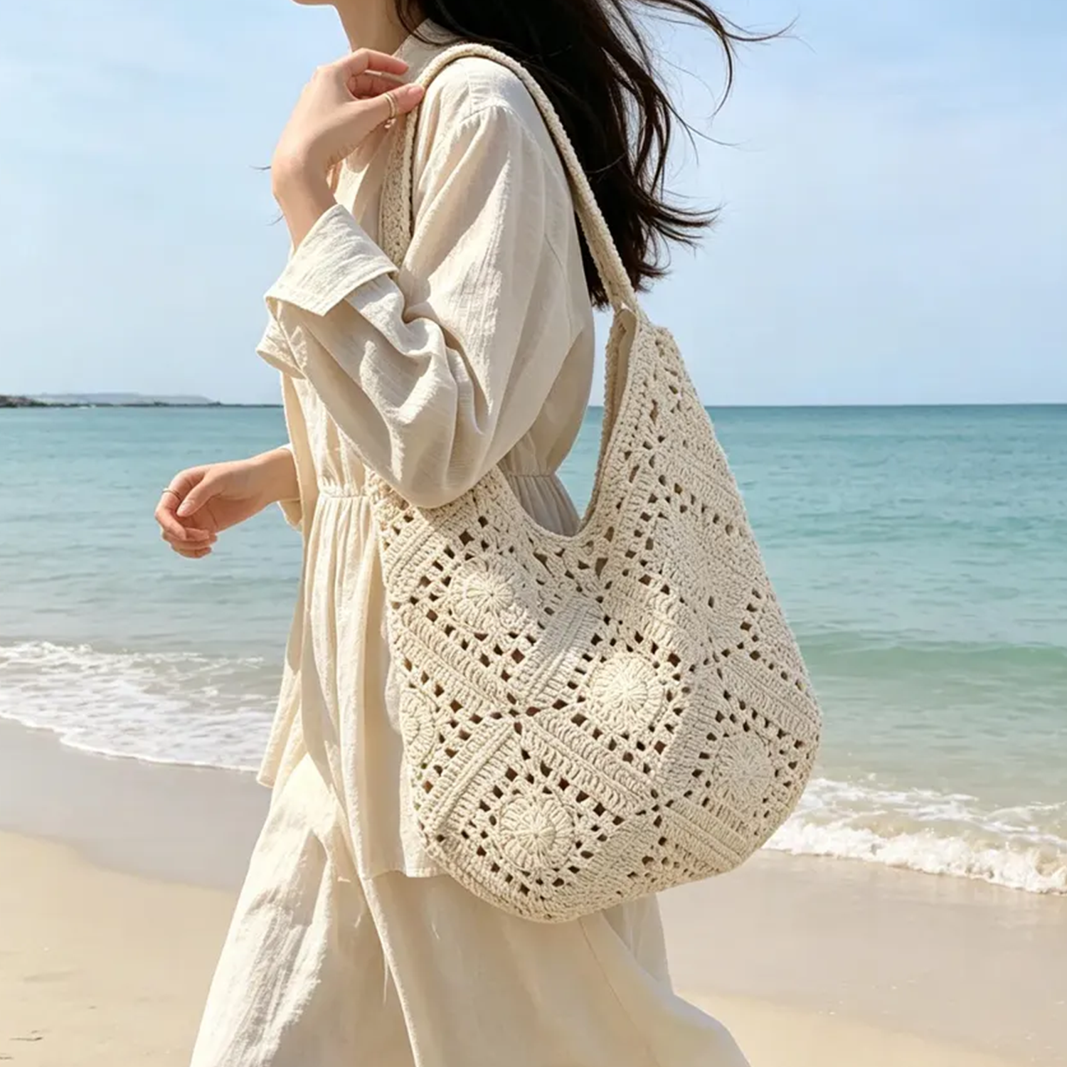 Cream Openwork Granny Square Crochet Slouch Crescent Shoulder Tote With Integrated Continuous Woven Loop Strap And Floral Rosette Panel Detailing