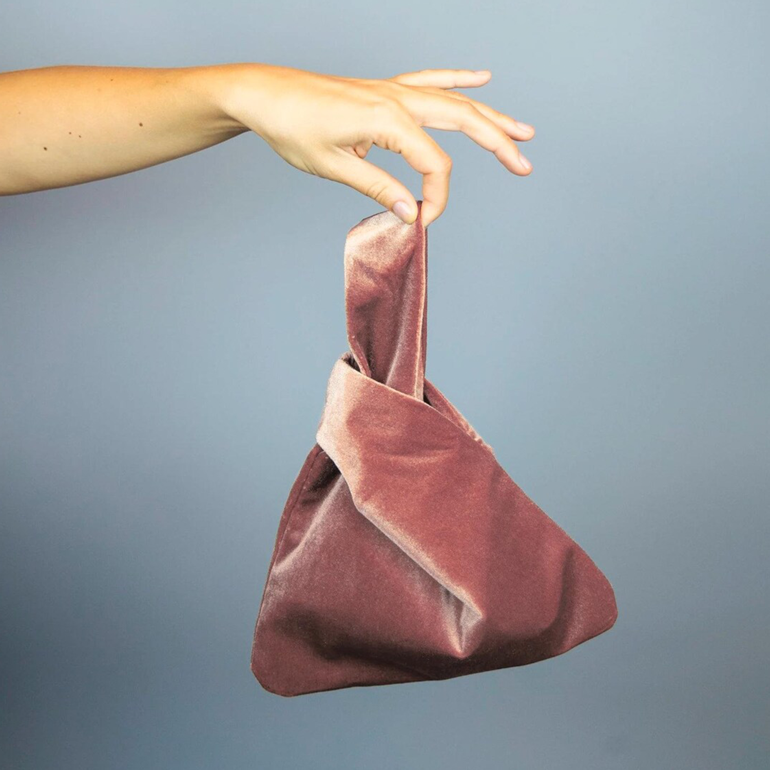 Soft Velvet Origami Triangle Handheld Pouch With Integrated Twisted Knot Wrist Loop And Smooth Satin Lined Compact Storage Cavity
