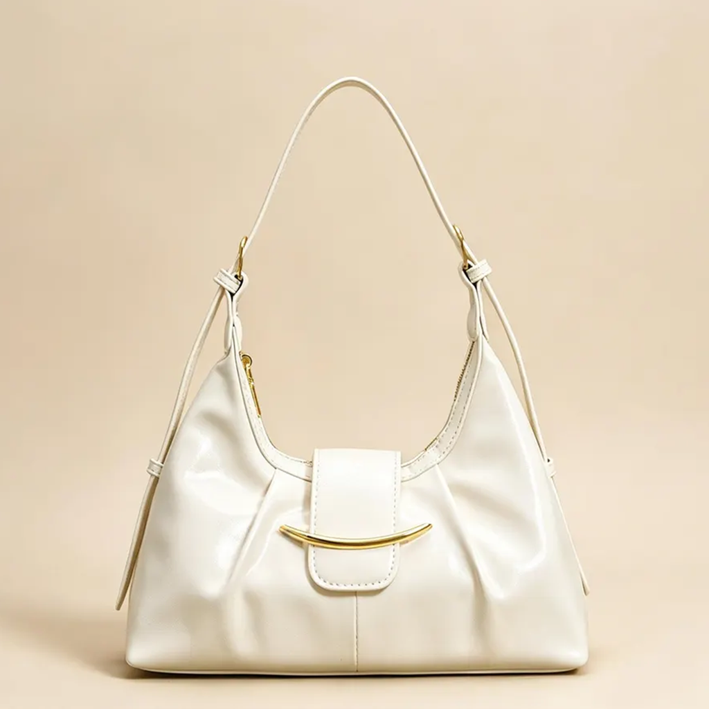 High-Gloss Gathered Pleat Crescent Underarm Bag With Curved Gold Bar Flap Accent, Slider Fitted Shoulder Strap And Secure Curved Top Zip Closure Hardware Leather Bag