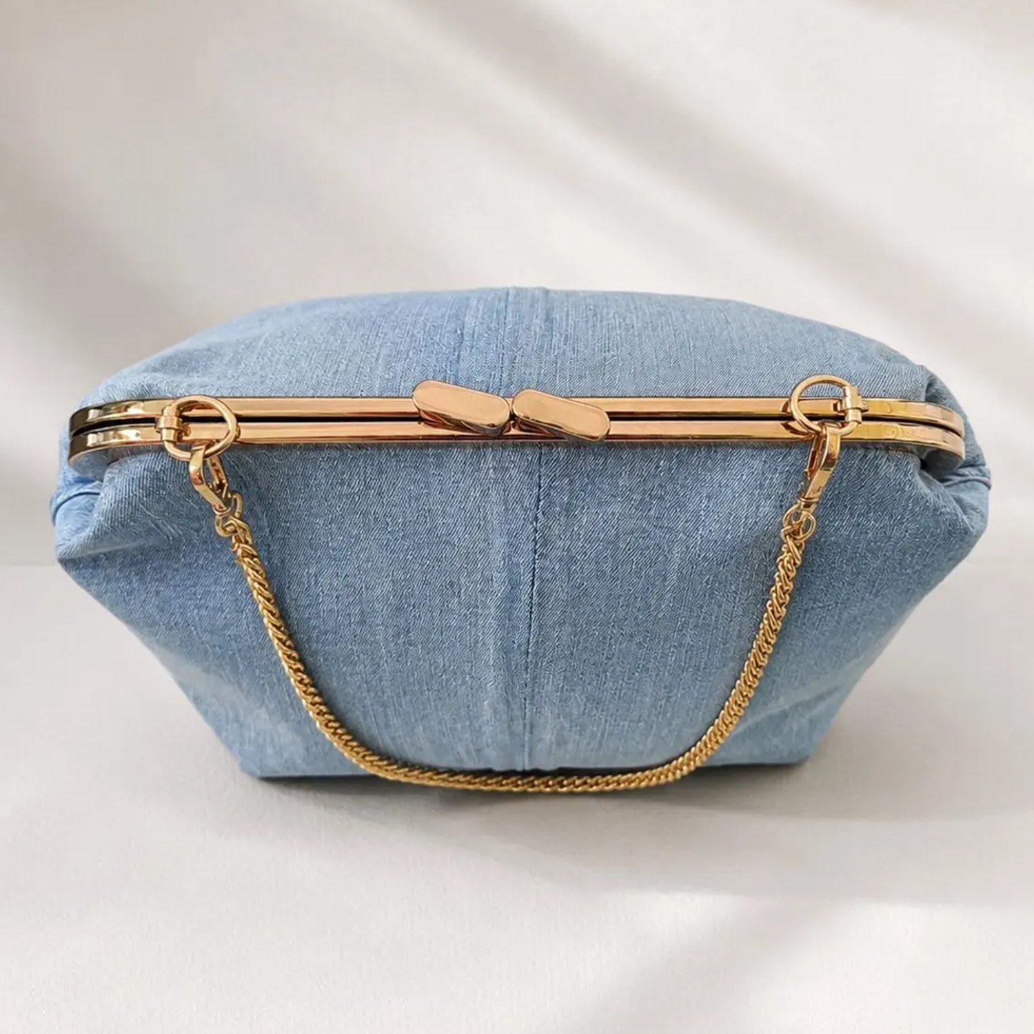 Light Wash Blue Woven Denim Rectangular Frame Clutch With Polished Gold Rim Press Clasp, Detachable Linked Metal Chain And Velvet Lined Inner Zip Divider Slot