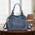 Faded Vintage Washed Blue Denim Slouchy Shoulder Tote With Vertical Braided Front Trim, Stud Reinforced Top Handles And Detachable Multi-Strand Denim Carry Strip Hardware